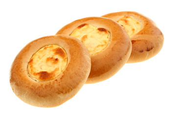 Three curd tarts on a white background