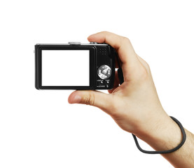 The digital camera in a hand