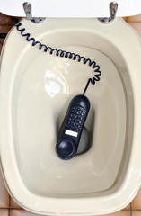 A telephone left in the toilet