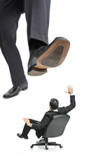 A giant foot about to squish a businessman in a chair