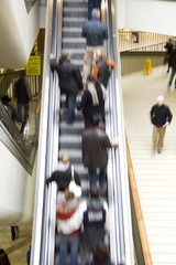 Blurred People on Escalator