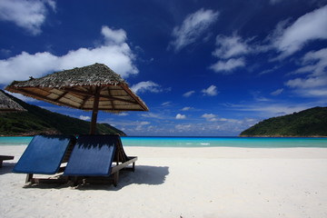 Chairs on a beautiful tropical island beach - 13229777