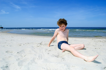 Boy playing on beach