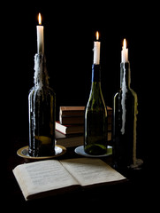 Three candles and books