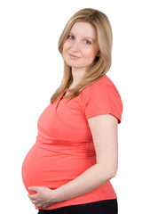 Studio portrait of the pregnant woman in red on a white backgrou