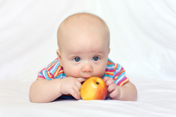 Beatiful little boy with apple