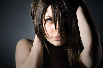 Studion Shot of Moody Teenager on Grey Background