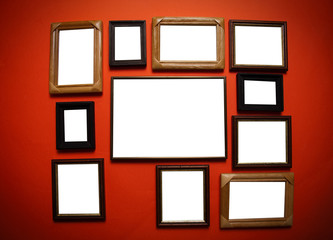 empty frames on red wall