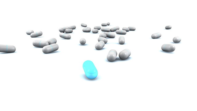 Placebo pills falling on the ground with one true pill