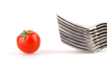 many forks and one tomato