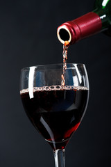 Fototapeta na wymiar Red wine poured in a glass