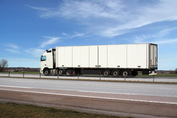 White truck and a pleasant blue sky.