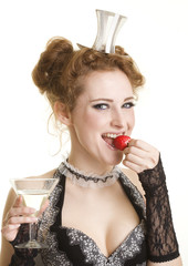 Girl with strawberry and glass of vermuth/