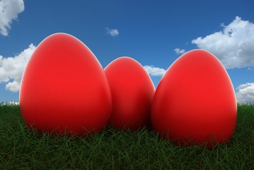 red easter eggs on grass