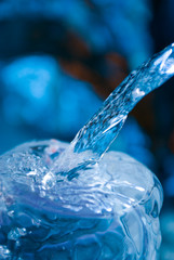 Water being poured into a  glass