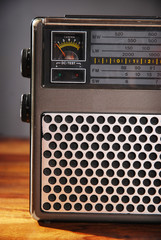 Close up of old radio on wooden table