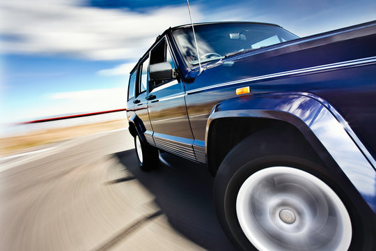 Blue Jeep In Motion