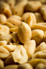 Macro close-up of fried salted peanuts