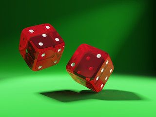 red dices on green background