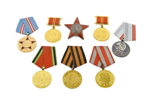The medals of soviet heroes isolated over white background