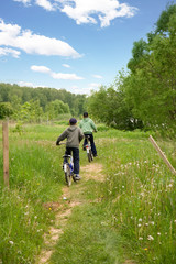 Two children on bicycles in the country