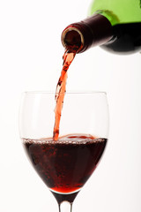 .Red wine poured in a glass