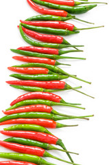 Red and green chili peppers isolated on the white
