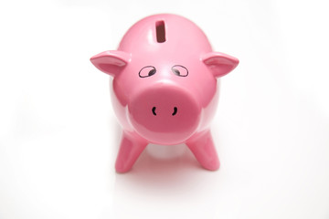 Piggy bank style money box isolated on a studio background.