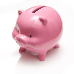 Piggy bank style money box on a white studio background.