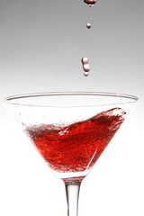 red cocktail on white