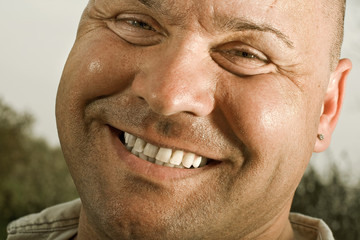 Laughing man in his garden