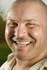 Laughing man in his garden