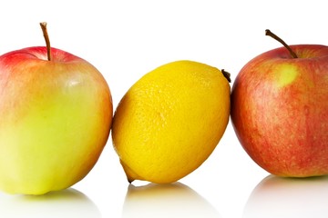 Lemon and apples on white background