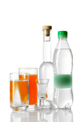 Different drinks in bottles and glasses