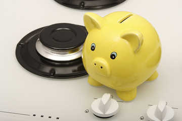 Piggy bank with a gas hob