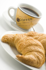 delicious continental breakfast of coffee and croissants