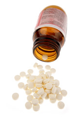 Pills spilling from bottle