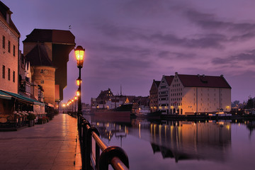 Obraz premium Riverside of Gdańsk at dawn.