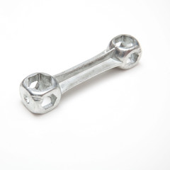 Bicycle spanner isolated on a white studio background.