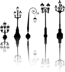 five street lamps with reflections