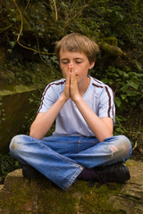 Young boy praying