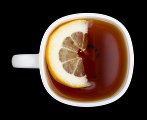 cup of tea with lemon on black view from above