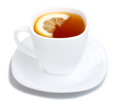 cup of tea with lemon and saucer on white