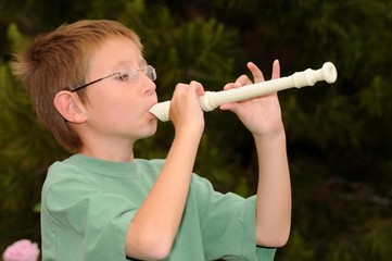 Boy playing a recorder