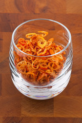 dried chopped red chilies in glass