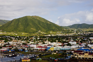 Colorful Coastal Town and Green Hill