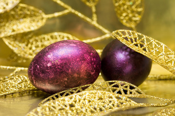 Easter eggs with golden leaves