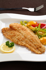 Fried fish fillet with vegetables