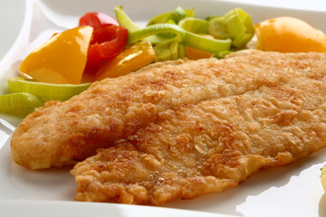 Fried fish fillet with vegetables