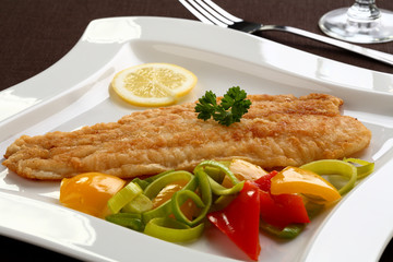 Fried fish fillet with vegetables
